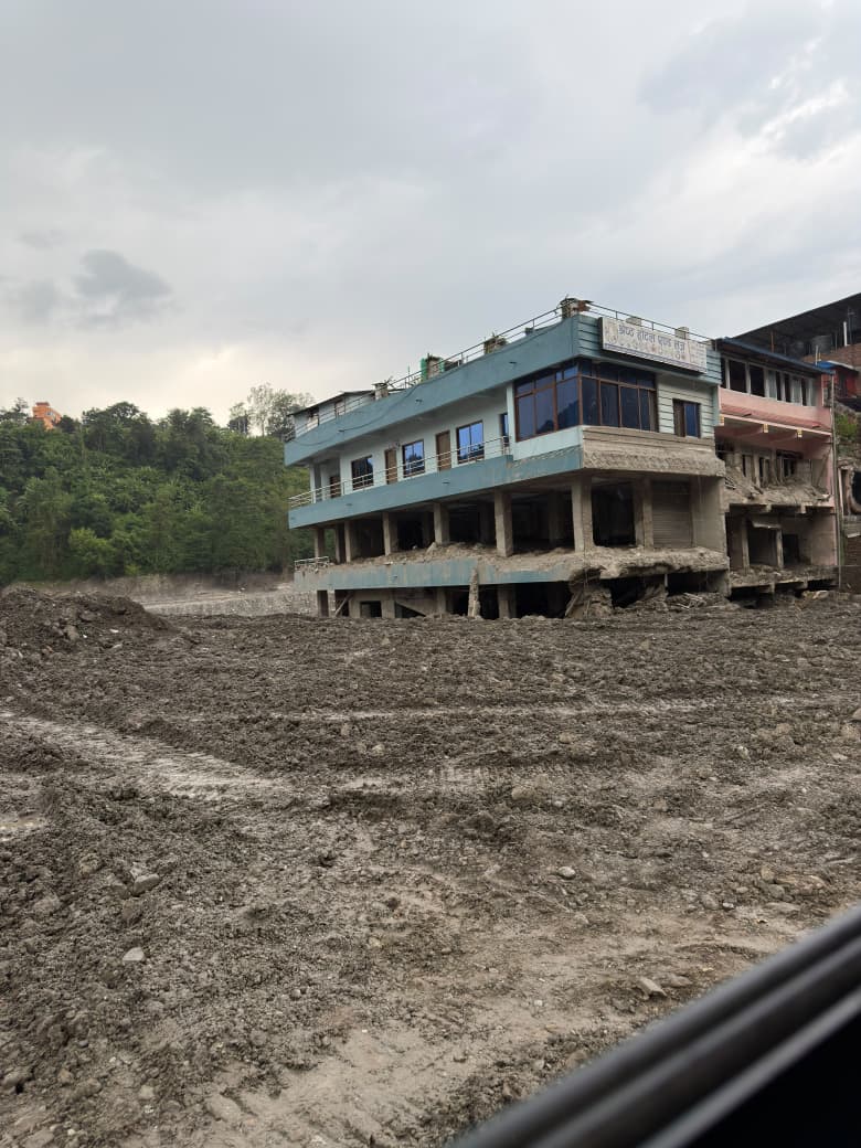 Flood-damaged building illustrating shelter and rebuilding needs